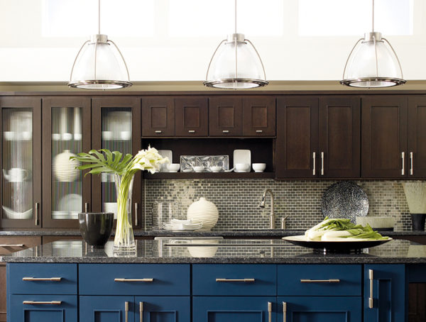 Brown Cabinets with Glass Inserts and Large Hanging Pendants Installed During Chicago Home Kitchen Remodeling Project